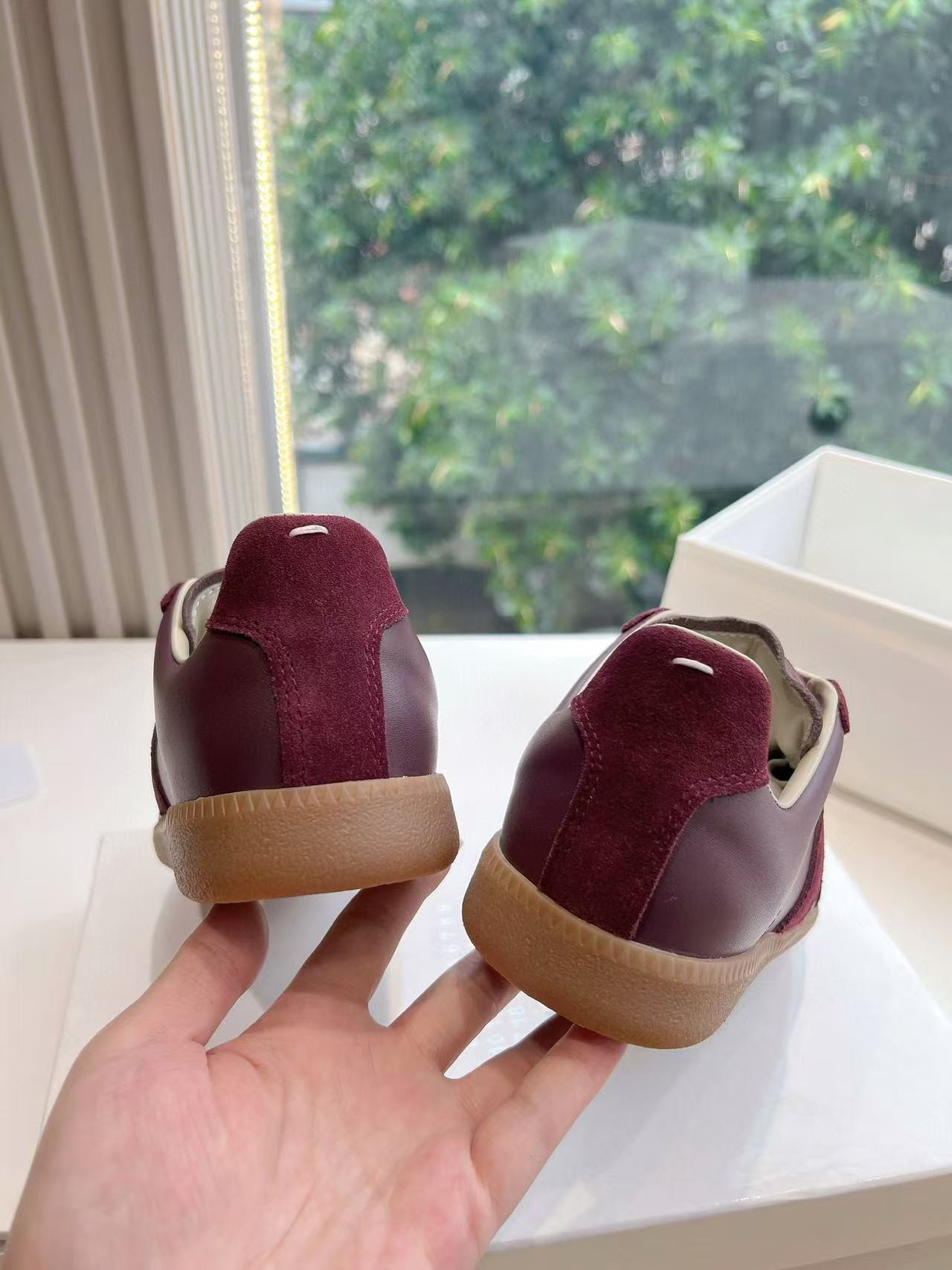 ua ma*s*n Ma*i*la mm6 sneakers